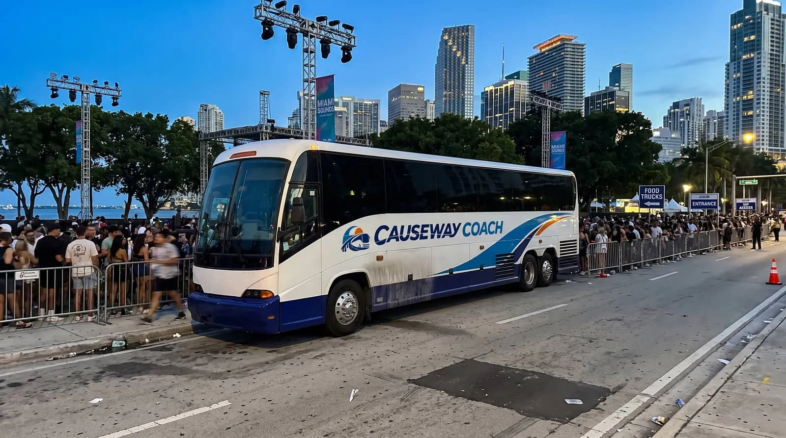 Causeway Coach motorcoach staged for a late-night pickup after a downtown Miami festival