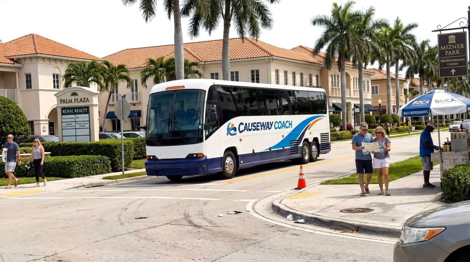 Causeway Coach mid-size coach at a Boca Raton resort entrance ready for a group transfer