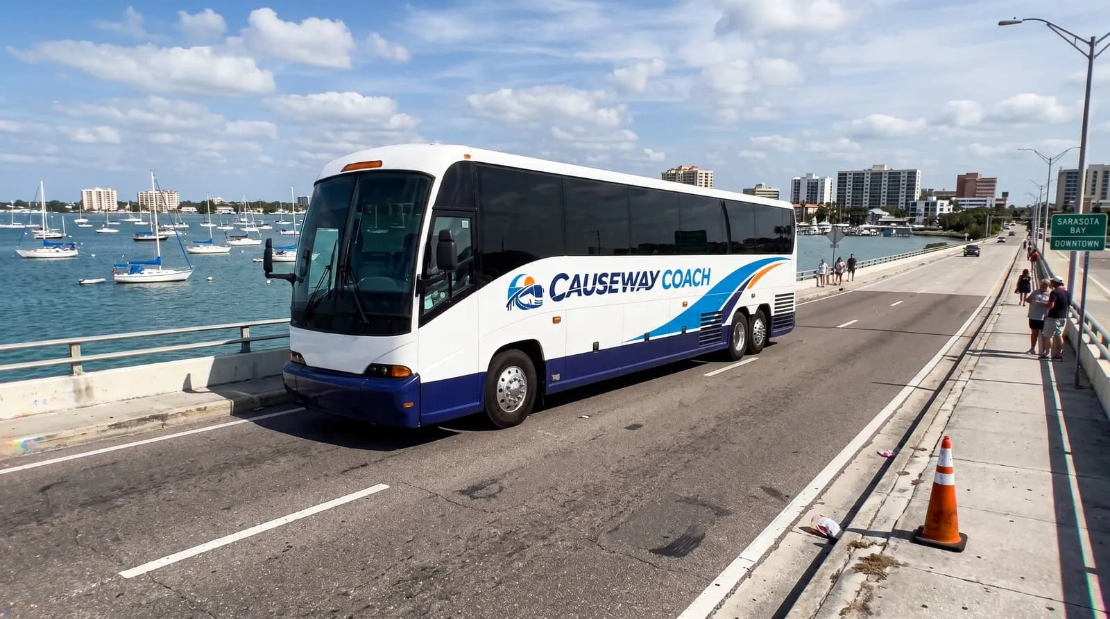 Causeway Coach motorcoach crossing a Sarasota bay bridge toward the barrier island keys